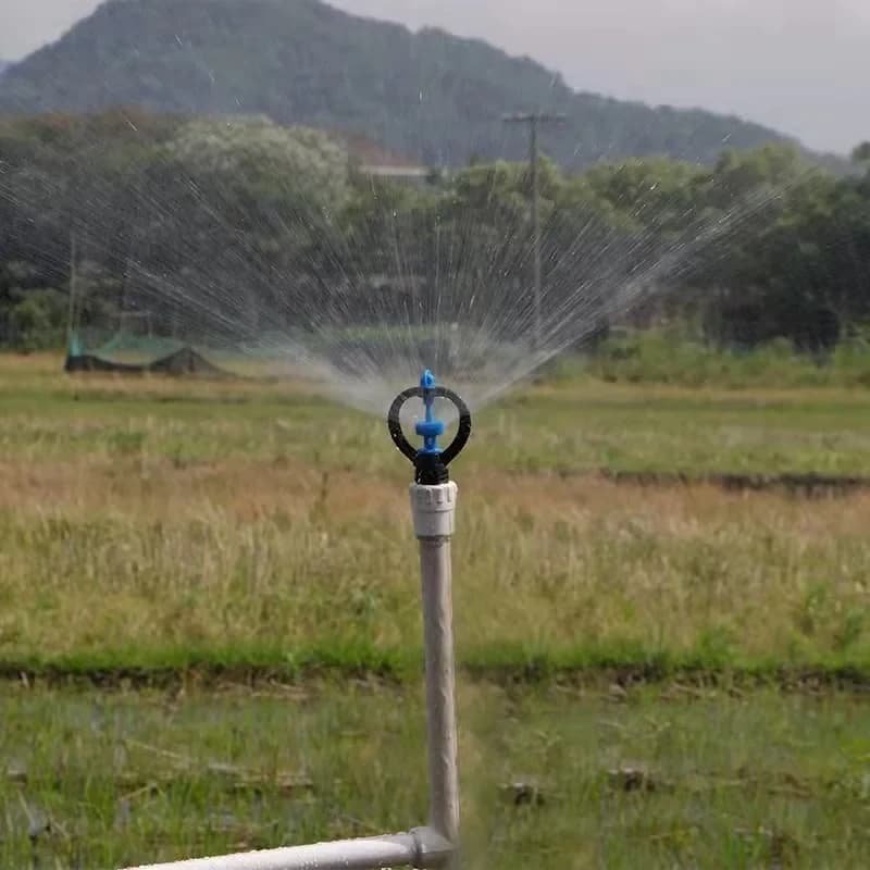 Butterfly wheel sprinkler operating in an agricultural field