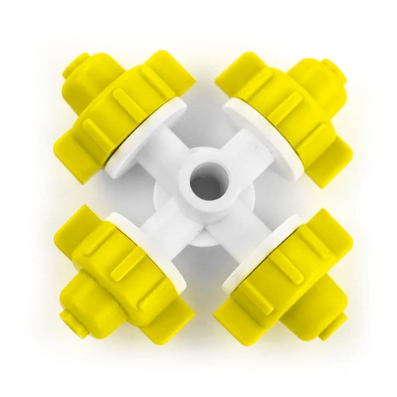 Yellow four-outlet misting nozzle viewed from above